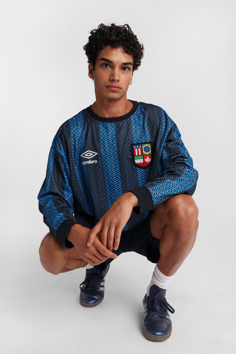 Maillot à manches longues col ras du cou Umbro World's Game Maillot à manches longues col ras du cou Umbro World's Game