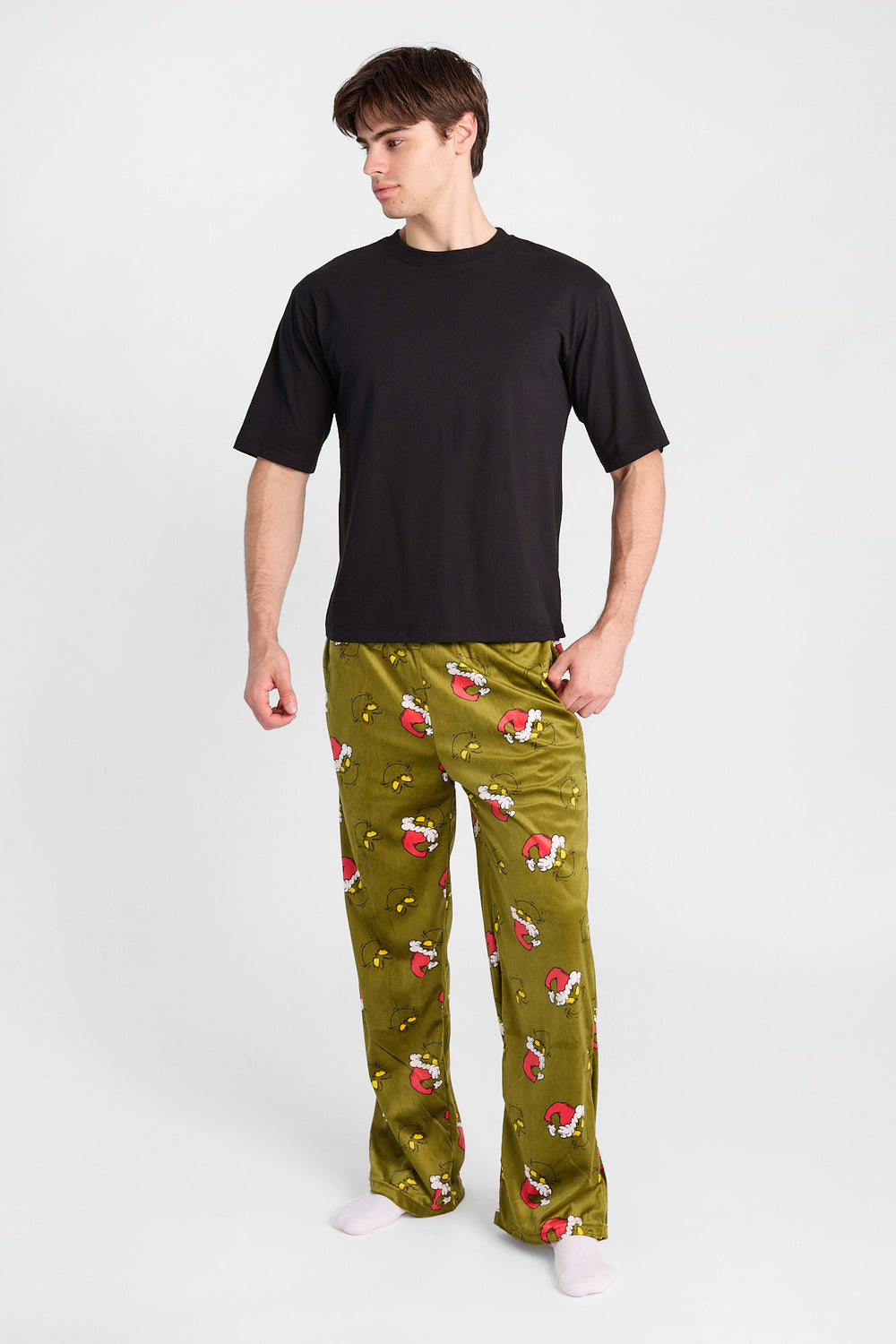 Pantalon de pyjama à imprimé de visages Le Grinch Pantalon de pyjama à imprimé de visages Le Grinch